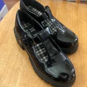 Never worn.  Have an indent on one shoe (on picture) on the corner.
